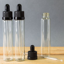 Load image into Gallery viewer, 10 Pack 1 Ounce (30mL) Clear Round Glass Dropper Bottles with Black Tops