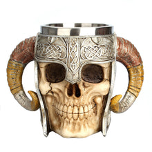 Load image into Gallery viewer, Drink up! This realistic viking skull mug features horn handles and holds 17 ounces of your favorite drink | Cup is food grade 304 Stainless Steel and the outer part is made of high quality resin | Also looks great as a decoration when stored on your shelf or bar when not in use | Great for Medieval themed parties and events, or as a gift for collectors of all things Gothic | Easy to clean the cup by hand. Please only use warm water to clean the resin portion. NOTE: NOT DISHWASHER SAFE