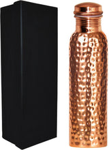 Load image into Gallery viewer, 100% pure copper drinking vessel with 30 ounce capacity, crafted by hand — superior quality Ayurvedic copper with a shimmering hammered exterior and comes packaged in an elegant gift box | Copper has strong antibacterial properties and can positively charge the water stored inside to offer a multitude of health benefits according to Ayurveda | Take it with you anywhere — it's seemless design and screw-on cap makes it leakproof, even if the bottle is held upside-down! | The metal retains the temp