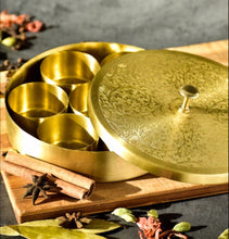 Load image into Gallery viewer, Medium Size Brass (Gold Color, Floral Pattern) Round Masala Dabba Box with 7 Containers and Mini Spoon, Measures 8-inches Wide x 1⅞-inches Tall
