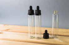 Load image into Gallery viewer, 10 Pack 1 Ounce (30mL) Clear Round Glass Dropper Bottles with Black Tops
