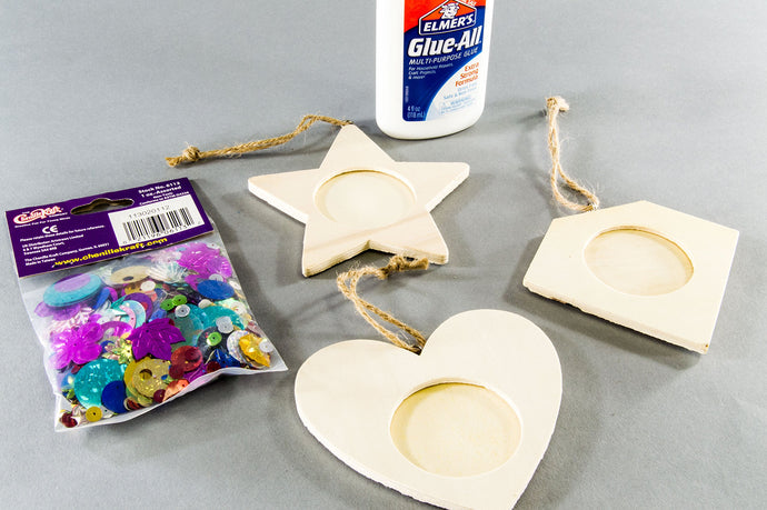 4oz. glue bottle | 6 ornaments (square, heart, star, superman chest outline, oval, and flower) | 1oz. bag of sequins & spangles