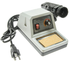 Load image into Gallery viewer, Features an AC receptacle on the back, allowing any soldering iron (up to 300W) to obtain variable heat | The AC receptacle also allows irons to be easily changed or replaced | The unit includes a holder funnel for the iron, sponge pad for cleaning the tip and an on/off switch with indicator light | The soldering iron holder can be assembled for mounting on the left or right side of the station | NOTE: A soldering iron is not included. It is suggested that you use 40 watt or 60 watt irons.
