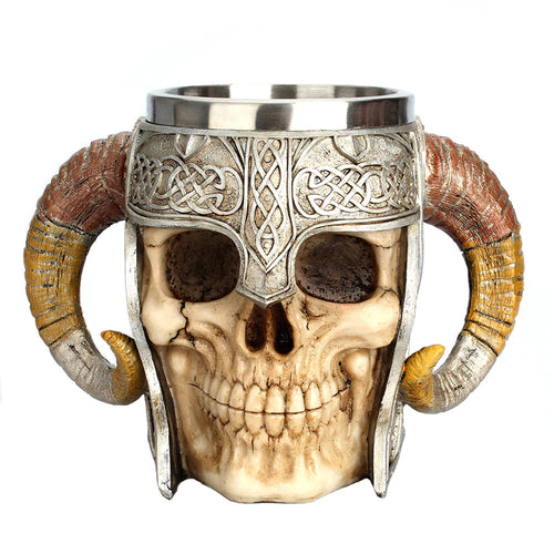 Drink up! This realistic viking skull mug features horn handles and holds 17 ounces of your favorite drink | Cup is food grade 304 Stainless Steel and the outer part is made of high quality resin | Also looks great as a decoration when stored on your shelf or bar when not in use | Great for Medieval themed parties and events, or as a gift for collectors of all things Gothic | Easy to clean the cup by hand. Please only use warm water to clean the resin portion. NOTE: NOT DISHWASHER SAFE