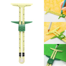 Load image into Gallery viewer, This handy 5-in-1 tool offers a Straight Hem Gauge, T-Gauge, Seam Allowance Marker, Buttonhole Spacer, and Circle Compass | Straight Hem Gauge - Fold your fabric and set the gauge to desired length, pin it and go along. T-Gauge - Draw a line with an exact measurement up to 6&quot;. Adjusts from 0 to 6 inches in 1/8 inch increments. | Seam Allowance Marker - The standard widths of seam allowance can be measured at the bottom of the ruler: The full width of the ruler measures 5/8&quot;, from edge to opening
