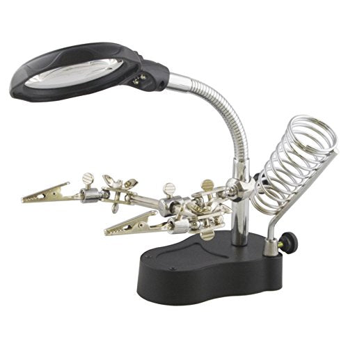 Holds your PCBs, hobby models, and other projects in the exact position that you need | Features two strong alligator clips and six ball joints that can be locked in position | Complete with an acrylic plastic 3.5x magnifier on a flexible goose neck and LED lights that can be turned on and off with the push of a button | Bottom battery compartment is furnished with a steel plate for stability | Built-in soldering iron holder that can be rotated and locked in place